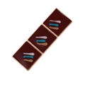 Macro detail of geometric enamel brooch featuring deep brown squares with colorful strokes - Red