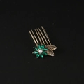 Vintage gold hair comb with green crystal flower and pearl accent on black background - Green Zirconia