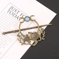Vintage bronze hair stick set with dragon motif and blue stone on white background - Flying Dragon Moon Hair Stick / Dark Gold
