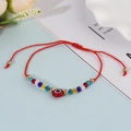 Bohemian evil eye bead bracelet with colorful crystals and adjustable red braided cord - Red
