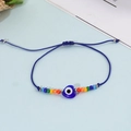 Bohemian colorful beaded evil eye bracelet with heart pendant and blue braided cord - Blue