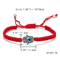 Detail of red woven bracelet with silver Hamsa Hand and blue evil eye bead pendant - Hamsa Hand Pendant Style