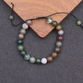 Detail van verstelbare gevlochten armband met kleurrijke natuurlijke agaatsteen kralen - Indiase Agaat