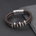 Detail view of double-strand brown leather bracelet with silver magnetic buckle and claw charms - Coffee + Silver