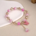 Macro detail of beaded butterfly bracelet featuring pink crystals and champagne beads - 6.5cm Diameter / Pink Butterfly Bracelet Style 1