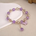 Elegant beaded bracelet with purple butterfly pendant and faceted crystals on a ceramic tray - 6.5cm Diameter / Purple Butterfly Bracelet Style 1