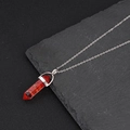 Hexagonal red crystal stone pendant necklace on a natural dark slate stone surface - Red Natural Stone Style (NS-0072) / Red