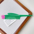 Detail of tulip-shaped hair comb in green and pink acetate with smooth polished finish - Tulip Style (S113) / 16cm x 3.4cm