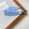 Detail of bird-shaped cellulose acetate wide-tooth comb with blue and marble textures - Blue Bird / 12cm*4cm