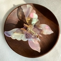 French vintage butterfly hair claw clip with pearlescent acetate finish on wooden tray - Mermaid Pink