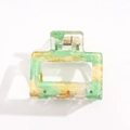 Detail of large square hair claw clip featuring green and gold marble resin texture - Green