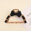 Detail of metal chain hair claw clip with black silk ribbon bow and golden teeth - Black