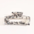Detail of a rectangular acetate hair claw with grey marble pattern and hollow center - Large / Splashing Ink Gray