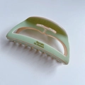 Detail of hollow acetate hair claw in light green and pink with Barrette la France logo - Mint Green