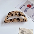 Macro shot of large leopard print acetate hair claw clip with gold Barrette la France text - Light Leopard