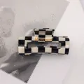 Close-up of a rectangular black and white checkerboard hair claw clip made of acetate - Black White Grid - Square