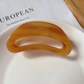 Close-up of translucent amber acetate hair claw clip featuring Creation France engraving - Caramel (9.5cm*4cm 20g)