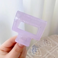 Detail of a purple rectangular acrylic hair claw clip with strong metal spring - 5cm / Jelly Purple