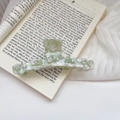 Detail of large acetate hair claw clip with floral marble texture and green rhinestones - Green / 11cm
