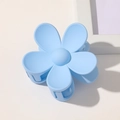 Close-up of light blue matte flower hair claw clip with spring on minimalist background - Sky Blue