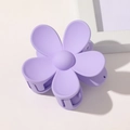 Close-up of a matte purple flower hair claw clip with a minimalist five-petal design - Lavender