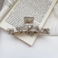 Large marble pattern hair claw clip with five flower rhinestones on an open book - Iridescent Gray / 11cm