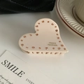 Dettaglio di un fermaglio per capelli a cuore beige in acetato con strass arancioni e testo - Bianco Sporco