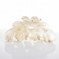 Detail of cream floral acetate hair claw clip with pearlescent finish and metal spring - Grayish White
