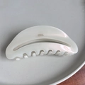 Detail view of large ivory acetate claw clip with gold-tone France Handmade lettering - 10.6cm / AB White