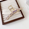 Macro detail of purple marble acetate inlay on gold metal claw clip on a jewelry tray - Iridescent Purple 13cm