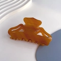 Macro detail of amber acetate hair claw clip showing France Handmade engraving inside - Amber - 8.8cm