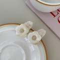 Close-up of elegant cream marble acetate flower hair clips in a ceramic dish - 4.5CM / White