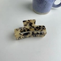 Macro shot of large acetate hair claw clip featuring classic tortoiseshell leopard print pattern - About 9cm / Light Leopard