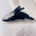 Detailed close-up of a glossy black whale hair claw clip with acetate textured finish - Whale Style (42#)