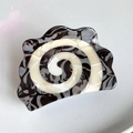 Detailed close-up of a large acetate hair claw with black and white spiral marble texture - Black Cocoa Spiral 8cm