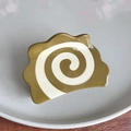 Close-up of acetic acid hair claw clip with olive green and ivory spiral pattern details - Mustard Cream Spiral 8cm