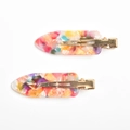 Detail view of colorful marble texture acetate hair clips with gold metal duckbill jaws - Magic Color (6cm)