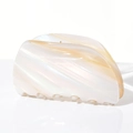 Macro detail of the acetate hair claw clip showing creamy pearlescent marble texture - Milk Tea