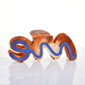 Close-up of brown tortoiseshell acetate hair claw with artistic blue wave letter design - 11cm / Blue