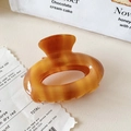 Chic tortoiseshell acetate hair claw clip with oval hollow design and glossy finish - Large / Caramel