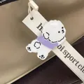 Dettaglio della molletta per capelli a forma di cane Teddy in acetato bianco - Fermaglio Laterale 5cm