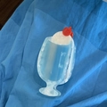 Detail view of cream soda acetate hair claw clip with blue marble texture and cherry accent - Blue Hair Claw (9.5cm)