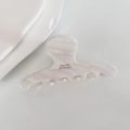Detailed macro view of the cream marble texture on this premium acetate hair claw clip - White