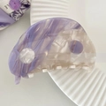 Detail shot of a purple marbled acetate hair claw clip with yin yang design and white teeth - Purple Tai Chi Style