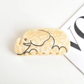 Detailaufnahme der Haarklammer in Elefantenform mit cremefarbenem Marmormuster und Linien - Marmormuster Elefant