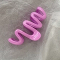 Detail view of a large wavy claw clip in a glossy lilac purple cream finish - 11cm / Taro Purple