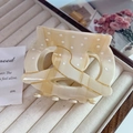 Detail view of acetate claw clip with marble texture, white dots and gold glitter lines - Large (8cm) / Beige