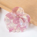 Macro shot of floral hair claw clip featuring pearlescent pink iridescent acetate finish - 6.4cm / Light Purple