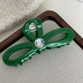 Détail d'une pince à cheveux vert vif en acétate ornée d'un cristal étincelant - Vert
