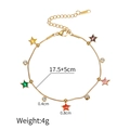 Detailed view of gold snake chain bracelet with multi-colored star and round cubic zirconia - Bracelet